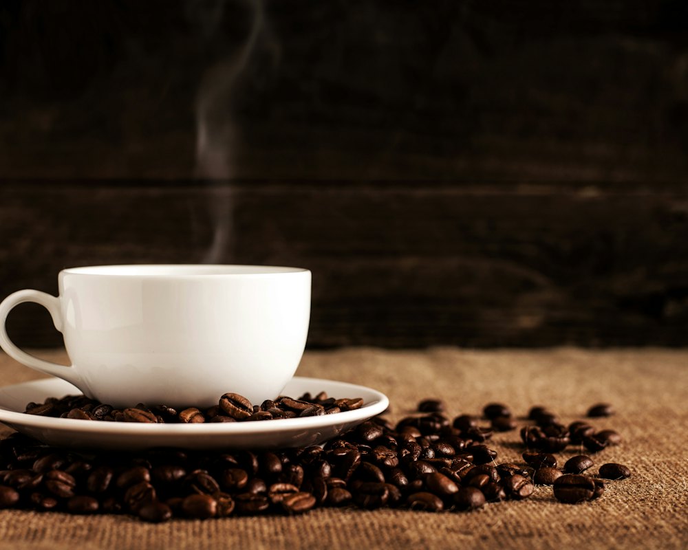 Steaming cup of coffee at night