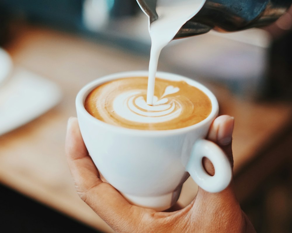 Milk poured into a latte