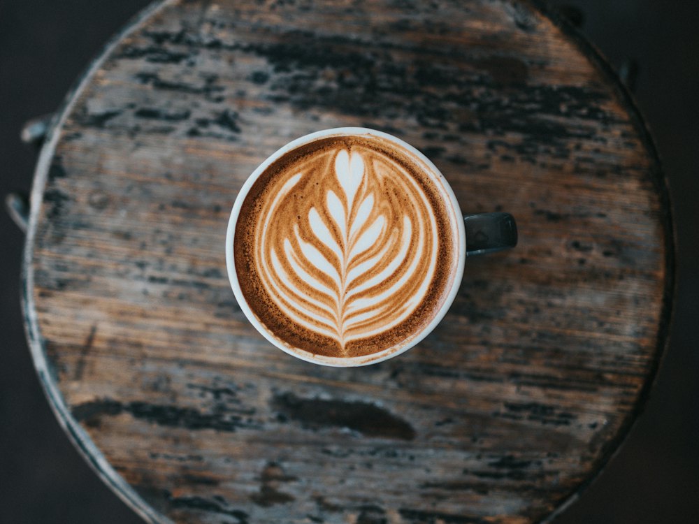 Latte art on a wooden table