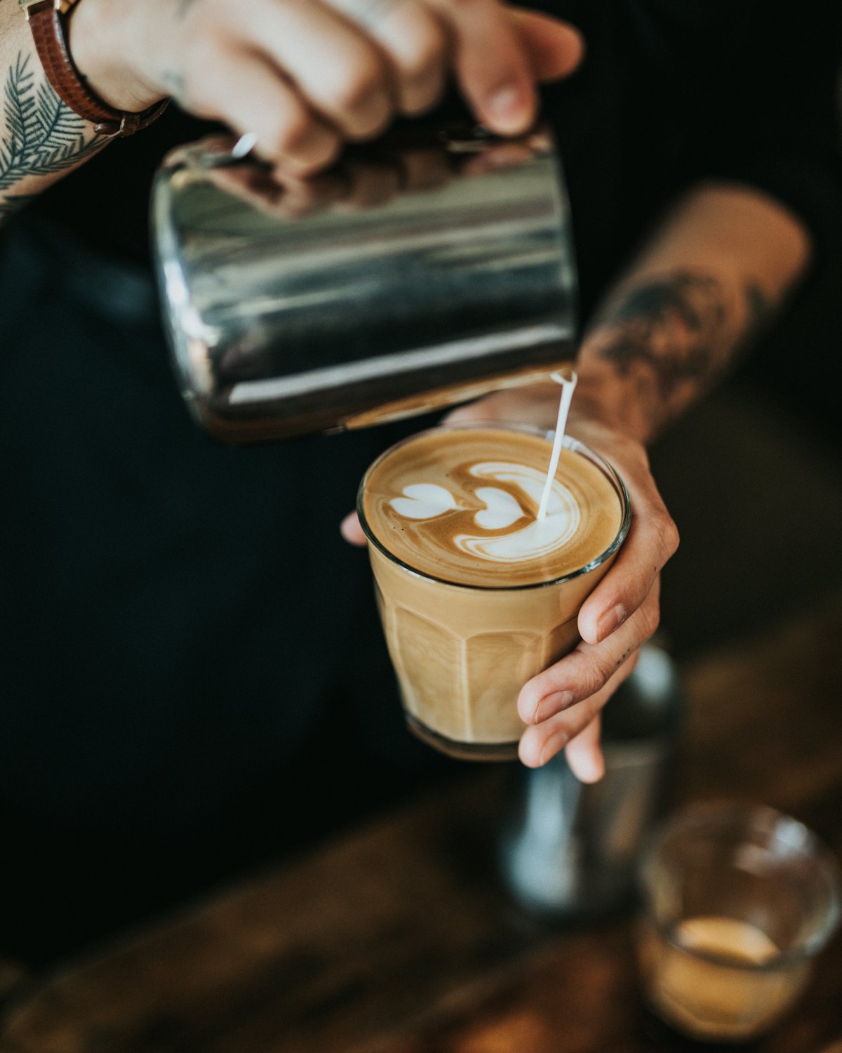 Barista pouring latte art