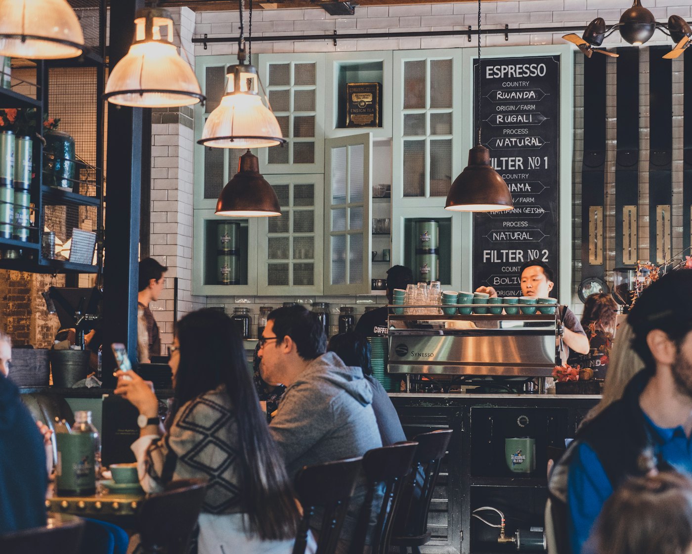 People talking over coffee in a café